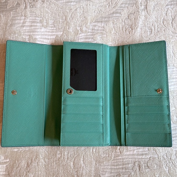 MCM Munchen trifold wallet in new condition except scratches on name plate. - Picture 15 of 15